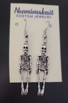 Skeleton earrings Please look at pictures for size Free First Class Mail Envelope if you want special shipping please message me will cost you more. Thank you for looking Skull Shaped Metal Earrings For Gifts, Handmade Metal Skull Earrings, Metal Skull Single Earring, Nickel Free Metal Skull Earrings, Skull-shaped Metal Earrings With Ear Wire, Metal Skull Earrings With Ear Wire, Mail Envelope, Metal Skeleton, Skeleton Earrings