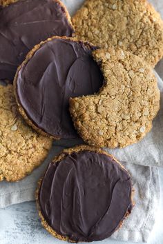 four cookies with chocolate frosting on top