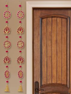 the door is decorated with red and gold decorations on it's side paneling