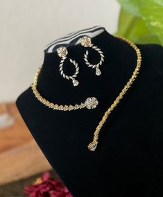 -Fall in love with this simple gold finished CZ AD necklace and earrings jewelry set! -Will suit very well for ethnic dresses for parties, weddings, and gatherings! Earrings measurements: -------------------------- Height: 4 cm Width : 2 cm  Care Instruction : Avoid Heat & Chemicals Like Perfume, Deo, Alchol, Etc. | Clean With Dry Cotton Cloth | Pack In An Air Tight Container After Use Gold Jewelry Sets With Matching Earrings For Party, Gold Bridal Necklace With Cubic Zirconia For Party, Gold Cubic Zirconia Bridal Necklace For Party, Hand Set Gold Plated Jewelry Sets For Party, Gold Plated Hand Set Jewelry For Parties, Party Gold Plated Hand Set Jewelry Sets, Gold Bridal Necklace With Elegant Design For Party, Yellow Gold Cubic Zirconia Jewelry Sets For Party, Gold Plated Bridal Necklace For Party