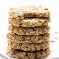 a stack of oatmeal cookies sitting on top of a cooling rack