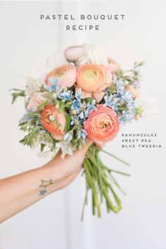 a person holding a bouquet of flowers in their hand