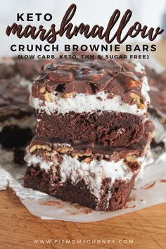 three brownies stacked on top of each other with the words keto marshmallow crunch brownie bars