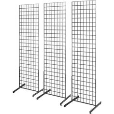 three black metal grids with four different sizes and shapes on each side, one in the