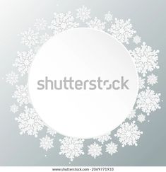 white snowflakes in the shape of a circle on a gray background with space for text