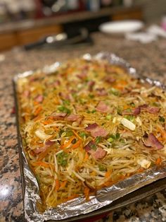 a pan filled with food sitting on top of a counter