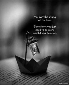 an origami boat with a lantern floating on it's side and the words you can't be strong all the time