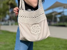 🏖️ Get ready for the beach or shopping with this stylish and durable fabric knitted bag! Perfect for carrying your essentials, this bag is made from high-quality fabric that can withstand the rigors of daily use. The knitted design adds a touch of elegance, making it the perfect accessory for any outfit. With plenty of space and a sturdy construction, this bag is both practical and fashionable. Whether you're hitting the beach or running errands, this bag has you covered in style! Beach Cotton Shoulder Bag With Adjustable Strap, Cotton Canvas Shoulder Bag For Beach, Casual Cotton Beach Shoulder Bag, Casual Cotton Shoulder Beach Bag, Casual Crochet Beach Bag For Daily Use, Cotton Shoulder Bag For Daily Use At Beach Season, Beige Cotton Bag For Beach Season, Beige Cotton Bags For Beach Season, Cream Cotton Shoulder Bag For Beach