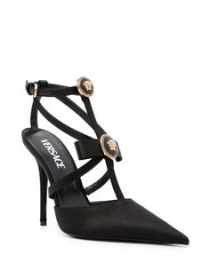 Archival motifs are a mainstay of Versace's high-octane aesthetic – take these black Gianni Ribbon pumps as an example. Crafted from lustrous satin to a sharp silhouette with a pointed toe and stiletto heel, they are adorned with cage-inspired 'nastro Gianni' bows punctuated by Medusa '95 hardware. Versace Pumps, Versace Heels, Versace Sandals, Gold High Heels, Chanel Camellia, Pink Pumps, Satin Pumps, Party Shoes, Black Pumps