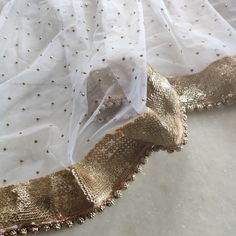 This Dupatta has glitter dots on net with beautiful golden border.  This can be your wedding dress chunni for Indian occasion wear for festival.  This has perfect bling for you to look classy and ethnic at same time.  Beaded border on dupatta. Pair it up with skirt and blouse from our shop. NOTE : There might be slight color variation due to different colour settings. Chunni Designs, White Net Dupatta, Indian Long Dress, Bridal Dupatta, Indian Lehenga Choli, Golden Border, Beading Netting, Lehenga Wedding, Punjabi Dress