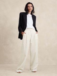 Crafted with warm-weather in mind, we cut this pleated pant from a lightweight woven fabric we love for its blend of silky TENCEL™ lyocell and breathable linen.  Here, we opted for minimalist details to best showcase the slub texture of this beautiful fabric.  High rise (11"), relaxed fit with wide leg.  Full length.  Sustainability: Made with TENCEL™ lyocell, a sustainably sourced fiber from responsibly-harvested trees.  Zip fly with hook-and-bar closure.  Front and back pockets.  Mother of Pea Wide Leg Gray Pants Outfit, Black Linen Wide Leg Pants, Pink Mochi, Travel Attire, Linen Pants Outfit, Pleated Pant, Leg Pants Outfit, Trouser Outfit, Beige Outfit