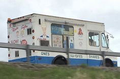 an ice cream truck driving down the road