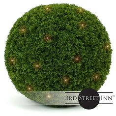 a ball shaped plant with lights on it's sides and the words 3rd street inn