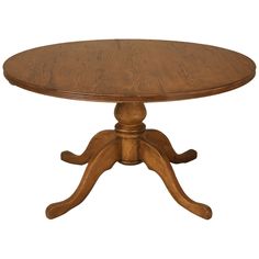 an oval wooden table with four legs and a center piece at the top, on a white background