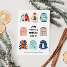 a card with ugly sweaters and orange slices on it next to some cinnamon sticks