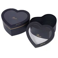 two black heart shaped boxes sitting next to each other