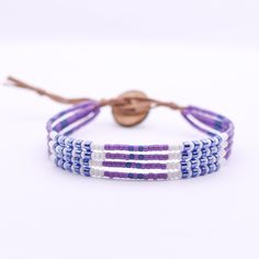 This multi layer bracelet is adjustable and has a second loop allowing some extra length.  Size: Adjustable from ~6.5-7in         >First Loop at ~6.5inches         >Second Loop at ~7inches Beads: 11/0 Glass Seed Beads         >Blue/Purple/White Clasp:  Coconut Button          >Brown Cord: Nylon Cord         >Brown *Photos are taken with care to ensure the color is portrayed correctly. However, due to different screen resolution, screen brightness, lighting, etc... from phone screens to computer screens, colors in the bracelet may differ slightly than pictured. If you have any questions, please don't hesitate to message me. Bohemian Purple Resizable Bracelets, Adjustable Purple Bracelet With Tiny Beads, Adjustable Purple Bracelets With Tiny Beads, Purple Beaded Friendship Bracelet With Sliding Knot, Adjustable Purple Friendship Bracelets For Beach, Adjustable Purple Beaded Friendship Bracelets, Adjustable Multi-strand Colorful Beads Wrap Bracelet, Adjustable Lavender Beaded Bracelets With Tiny Beads, Adjustable Blue Multi-strand Wrap Bracelet