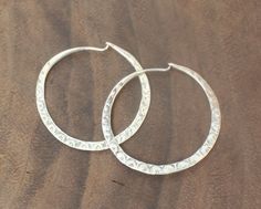 Vintage Navajo Hand Stamped Hammered Hoop Earrings Reproduction Sterling Silver Handmade Artisan Hoop Jewelry, Artisan Handmade Hoop Jewelry, Artisan Handmade Small Hoop Earrings, Artisan Sterling Silver Hoop Earrings For Festivals, Traditional Handmade Hoop Earrings For Anniversary, Artisan Small Hoop Hand Forged Earrings, Artisan Hand Forged Hoop Earrings, Artisan Hand Forged Small Hoop Earrings, Handmade Adjustable Traditional Hoop Earrings