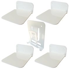 four pieces of white plastic sitting on top of each other