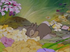 the rabbit is sleeping among flowers and grass in this animated scene from disney's winnie the pooh