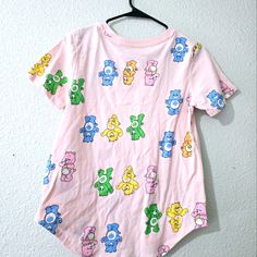 Pink Carebear Shirt Size Medium New With Tags Playful Graphic Print Tops For Loungewear, Casual Cotton T-shirt With Bear Design, Cute Multicolor Loungewear Tops, Cute Multicolor Tops For Loungewear, Summer Bear Print Short Sleeve T-shirt, Summer Bear Print Crew Neck T-shirt, Pink Funny Print Top For Loungewear, Cute Tops With Funny Print For Loungewear, Pink Tops With Funny Print For Loungewear