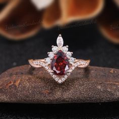 Vintage Pear Garnet Engagement Rings Red Gemstone Ring Vintage Half Eternity Wedding Ring Antique Moissanite Cluster Ring Anniversary Gift RING DESCRIPTION ✦Engagement Ring ✴Center Stone - Garnet Size - 6*8mm ✴Side Stones - Moissanite Shape - Round Cut Weight - About 0.448ct ✴Band Width - About 1.7mm ✴Ring Metal: Available in rose gold plated, yellow gold plated, 925 sterling silver, 10k or 14k solid rose, yellow or white gold. MAKING & SHIPPING ✦PAYMENT PLAN ♡ We provide layaway plans which can Elegant Ruby Wedding Ring With Halo, Fine Jewelry Cubic Zirconia Ruby Ring For Wedding, Anniversary Ruby Ring With Moissanite Center Stone, Ruby Moissanite Ring With Center Stone For Anniversary, Red Brilliant Cut Rings For Wedding, Red Brilliant Cut Wedding Rings, Red Marquise Cut Diamond Ring, Red Marquise Brilliant Cut Ring, Red Cluster Ring With Brilliant Cut For Wedding