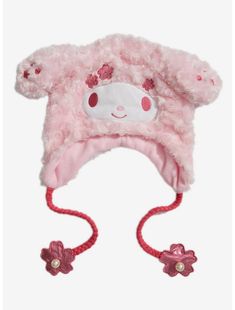 a pink hat with flowers on the side and a white bear face in the center