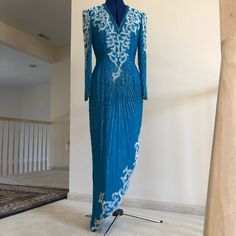 Spectacularly Flattering Beaded Long Sleeved Formal Evening Gown With Asymmetrical Hemline. 100% Silk With Rayon Lining. Size 10 Nwt Turquoise. Shimmers With Elegance At Night. Blue Sequin Dress For Reception, Blue Embellished Dress For Reception, Embellished Blue Dresses For Reception, Embellished Blue Dress For Reception, Blue Embellished Evening Dress For Reception, Embellished Blue Evening Dress For Reception, Blue Dresses With Fitted Bodice For Reception, Floor-length Turquoise Gown For Party, Floor-length Blue Dress For Reception