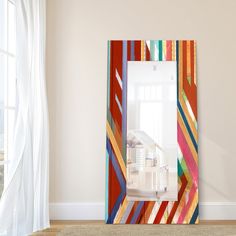 a large mirror sitting in the corner of a room