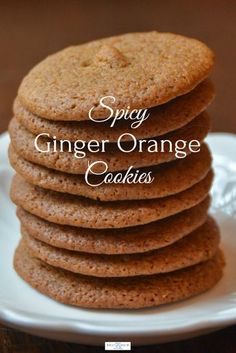 stack of ginger orange cookies on a white plate with the words spicy ginger orange cookies