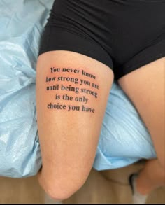 a person with a tattoo on their leg that says, you never know how strong you are