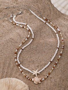 Product Details: handcraft Multi-layer necklace material: Faux pearls and metal Necklace type: pendant necklace Item Type: Necklace Style: Art Deco, Bohemian, Hippie Sophisticated or fashionable: fashionable Necklace usage: travel, vacation, summer beach, daily, party, women's gift See more: Necklaces Immerse yourself in the tranquil beauty of the seaside with our Beach Starfish Shell Necklace. Handcrafted with genuine shells and adorned with a delicate starfish charm, this enchanting piece evok Multi Layer Necklace, Shell Necklaces, Metal Necklaces, Multi Layering, Starfish, Faux Pearl, Gifts For Women, Shells, Pendant Necklace