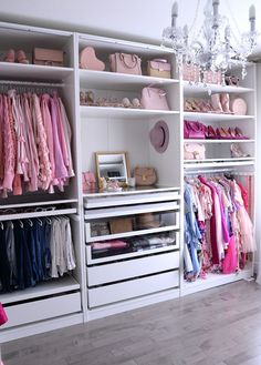 the closet is filled with many different types of clothes and accessories, including pink shoes