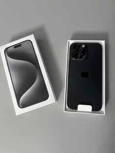 an iphone 11 pro in its box next to it's packaging