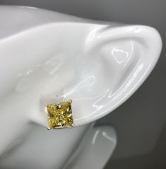 Diamond Details: carat - 10.00 TCW color - Canary Yellow (no tint / highest quality) clarity - FL-IF (very clear / highest quality) shape - Princess type - High Quality Created Diamonds More Diamond Details: brilliance - Extremely High polish - Excellent Metal Details: type - 14k White, Yellow or Rose Gold Retail: $800.00 These stud diamond earrings are made from solid white 14k gold. Very comfortable with a secure lock. Polished to a Brilliant Shine! Great addition to your jewelry collection. E Yellow Diamond Cut Fine Jewelry Earrings, Yellow Diamond Cut Earrings Fine Jewelry, Formal Yellow Diamond Earrings With Diamond Cut, Formal Yellow Diamond Cut Earrings, Gia Certified Yellow Gold Earrings For Anniversary, Yellow Diamond Earrings For Anniversary, Fine Jewelry Yellow Earrings For Anniversary, Yellow Fine Jewelry Earrings For Anniversary, Classic Yellow Gia Certified Jewelry