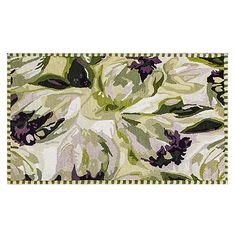 an area rug with purple flowers and green leaves on the bottom, in front of a white background