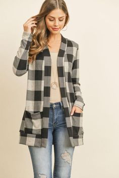 Plaid Love || Customer Favorite Available in Red, Hunter Green, and Oatmeal buffalo plaid Open front long sleeve cardigan sweater Medium weight brushed flannel fabric Fits true to size Slight stretch 97% Polyester, 3% Spandex Measurements approximately: Small: Bust 36", Length 29" Medium: Bust 40", Length 30" Large: Bust 44", Length 31" X Large: Bust 48", Length 32" Buffalo Plaid Cardigan, Jeans And Combat Boots, Pattern Cardigan, Plaid Cardigan, Patterned Cardigans, Flannel Fabric, Open Cardigan, Long Sleeve Cardigan, Buffalo Plaid