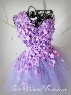 You're going to love our Flower Petal Dress line: beautiful tulle tutu elegantly accented with flower petals with coordinating pearl bead centers.  This dress style is perfect for showcasing your precious little flower girl and can be made in a variety of colors to showcase your wedding color selections. This dress selection is for our Lavender/Lilac flower petal dress with one flower strap, but this dress is available in wide ribbon shoulder straps as well as strapless. **CUSTOMIZATION OPTIONS* Fitted Pageant Dress For Bridesmaid In Prom Season, Fitted Pageant Dress For Bridesmaids, Bridesmaid Fitted Pageant Dress For Prom, Fitted Bridesmaid Pageant Dress For Prom Season, Spring Wedding Ball Gown Pageant Dress, Fitted Fairy Dress For Spring Pageant, Spring Princess Dress With Fitted Bodice For Bridesmaid, Purple Floral Applique Princess Dress For Wedding, Purple Princess Dress With Floral Applique For Wedding