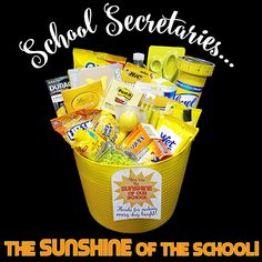 a yellow bucket filled with school supplies and the words school secretary's on it