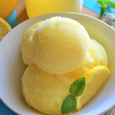 two scoops of lemon ice cream in a white bowl