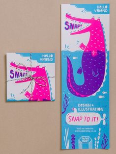 two greeting cards, one with a pink and blue whale on the front each card has a message that says snap to it