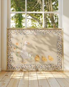 an image of a duck and her chicks in the window sill with sun shining through