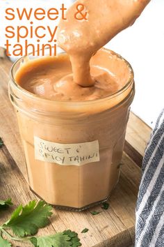 a spoon full of sweet and spicy tahini sauce