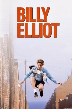 the movie poster for billy ellott is shown in red and black with an image of a boy jumping over a brick wall