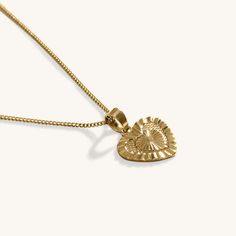 Our 18k Gold Heart Pendant Necklace features an gorgeous delicate chain, coupled to an intricately designed Heart pendant. This chain pairs beautifully with other chain necklaces or pendants. Perfect for day or night, this necklace is perfect for any occasion. When you're not wearing this piece, tuck it away in your very own Milou jewellery box provided. Stainless Steel, plated with 18K Gold Chain Length: 50cm Pendant Width: 2cm Waterproof (Tarnish Resistant) Natural Linen Milou Jewellery Box In Sterling Silver Heart Pendant Charm Necklace, Tarnish Resistant, Sterling Silver Tarnish Resistant Heart Pendant Charm Necklace, Sterling Silver Tarnish Resistant Heart Pendant Necklace, Gold Plated Double Heart Necklace, Heart Pendant Necklace With Adjustable Chain, Heart Pendant Necklace With Delicate Chain For Her, Delicate Tarnish Resistant Necklaces For Valentine's Day, Sterling Silver Heart Pendant Necklace Tarnish Resistant, Sterling Silver Tarnish-resistant Heart Pendant Necklace