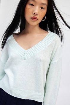 Forever staple BDG sweater in an effortless pullover sweater style. Designed in a boxy & cropped fit featuring a wide v-neckline and drop shoulders for a slouchy look. Finished with ribbed knit trim. Find it only at Urban Outfitters. Features BDG Jenna cropped v-neck sweater Slouchy oversized sweater Soft and stretchy knit Wide v-neckline and long sleeves with ribbed knit trim Ribbed knit hem Boxy, relaxed fit Cropped length Easy pullover style UO exclusive Contents + Care 53% Recycled polyester Oversized V-neck Cropped Sweater For Spring, Trendy V-neck Cropped Sweater For Spring, V-neck Cropped Sweater For Spring, Casual V-neck Cropped Sweater For Loungewear, Relaxed Fit V-neck Sweater For Spring, Bdg Jeans, Slouchy Sweater, Blue Fits, Exclusive Collection