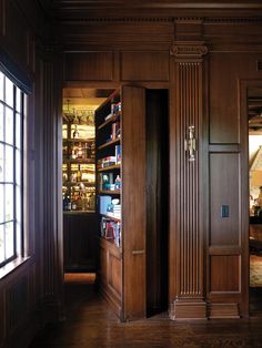 an open book case in the corner of a room