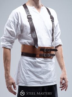 This  MEDIEVAL CHAUSSES BELT WITH SUSPENDERS combines all the advantages of a classical arming belt and additional ADVANTAGES:  - It fastens by leather straps with buckles, which allows you to adjust the overall length of the arming girdle belt  - Suspenders relieves the weight of products tied to this belt  SUITABLE FOR: SCA, HEMA, LARP and reenactment events, medieval festivals, and stage performances.  By the personal order, we can change arming girdle layers quantity, add padding to the belt base, change its fabric type and color, belt size... For any changes, please contact us via email sales@steel-mastery.com.  As belt placing between the waist and hips, so:  S-size belt (95cm length or 37.4 in) fits 81-91cm waist or 32-36 in  M-size belt (105cm length or 41.6 in) fits 91-101cm waist Adjustable Leather Harness With Belt, Leather Harness With Straps, Leather Strapped Harness With Belt, Medieval Corset Belt For Larp With Belt Loops, Fitted Leather Harness With Belt, Belt Suspenders, Girdle Belt, Medieval Festival, Leather Suspenders