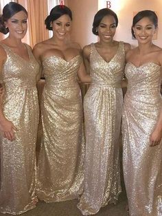 the bridesmaids are all dressed in gold sequins and posing for a photo