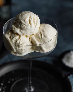 three scoops of ice cream in a glass bowl